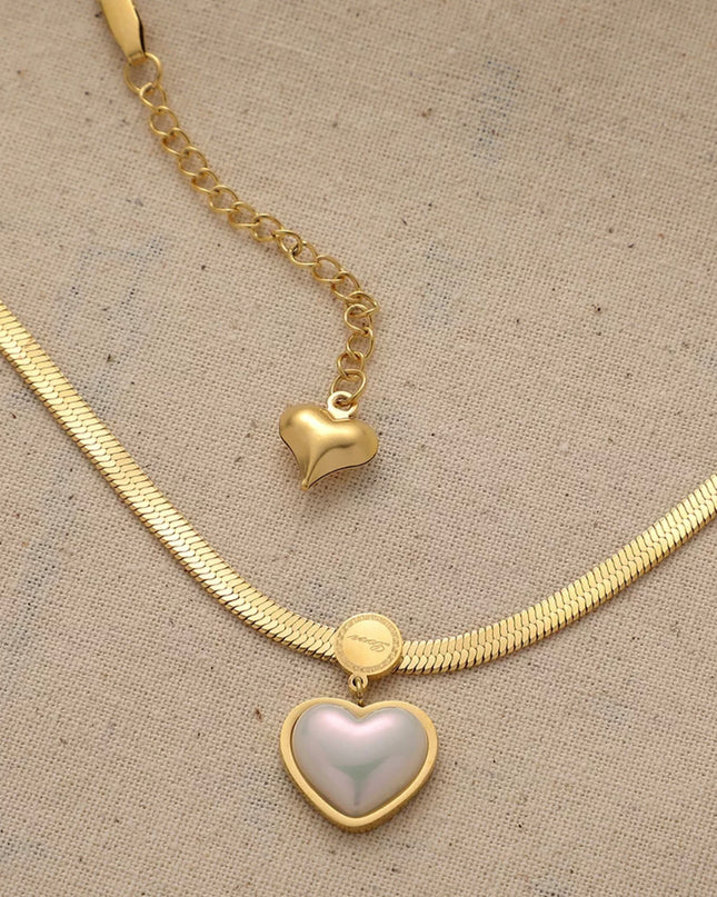 Collar de corazón de acero de titanio resistente al agua lleno de oro de 18 k. 